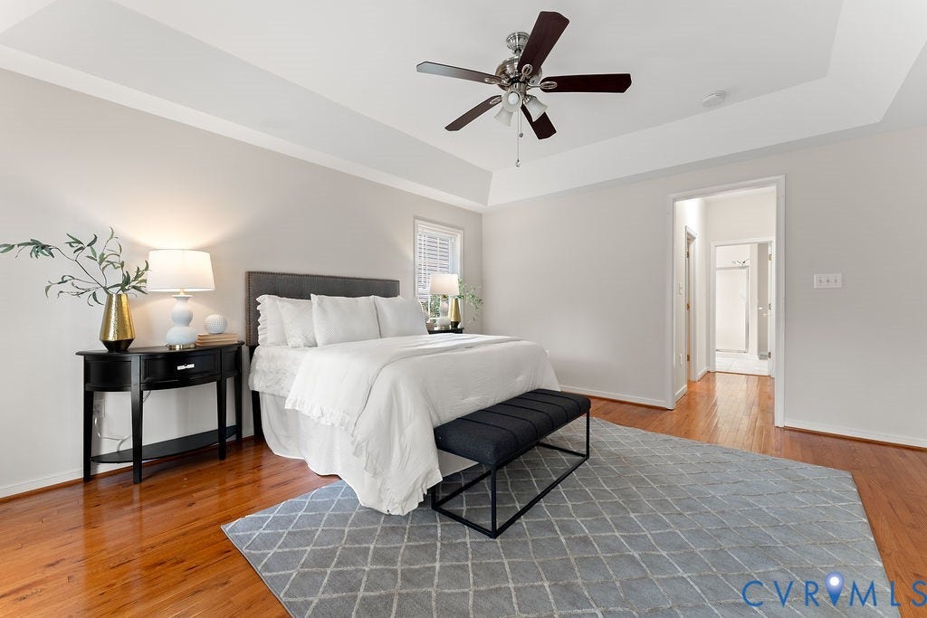 5316 Lemoore Drive, Glen Allen, VA 23059 Tray ceiling with crown molding, ceiling fan, wood-finish flooring, white window blinds, and a doorway to an adjoining room