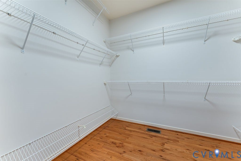 5316 Lemoore Drive, Glen Allen, VA 23059 Walk-in closet featuring wire shelving, white walls, and wood-finish flooring