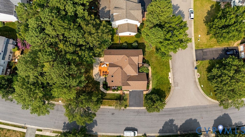 5316 Lemoore Drive, Glen Allen, VA 23059 Single-story residence featuring a brown shingle roof, an attached deck, and a paved driveway
