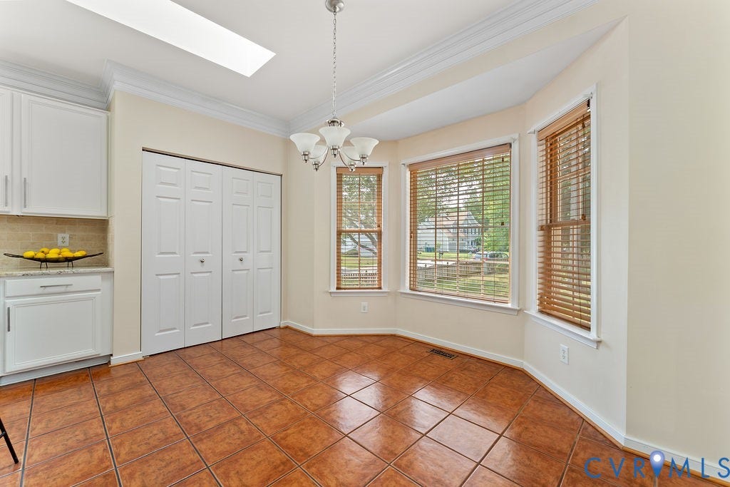 5316 Lemoore Drive, Glen Allen, VA 23059 Dining area featuring a bay window, ceramic tile flooring, and a skylight
