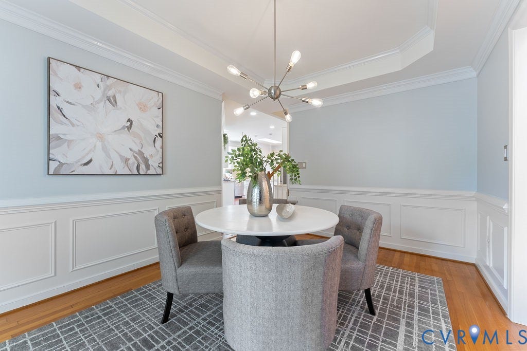 5316 Lemoore Drive, Glen Allen, VA 23059 Dining area featuring hardwood flooring, wainscoting, crown molding, a tray ceiling, and a contemporary chandelier