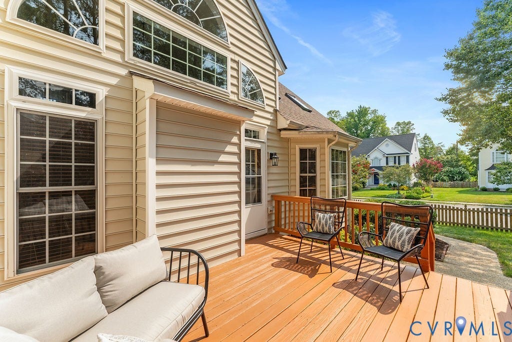 5316 Lemoore Drive, Glen Allen, VA 23059 Wood deck with railing, featuring a stone path, bay window, and arched transom windows