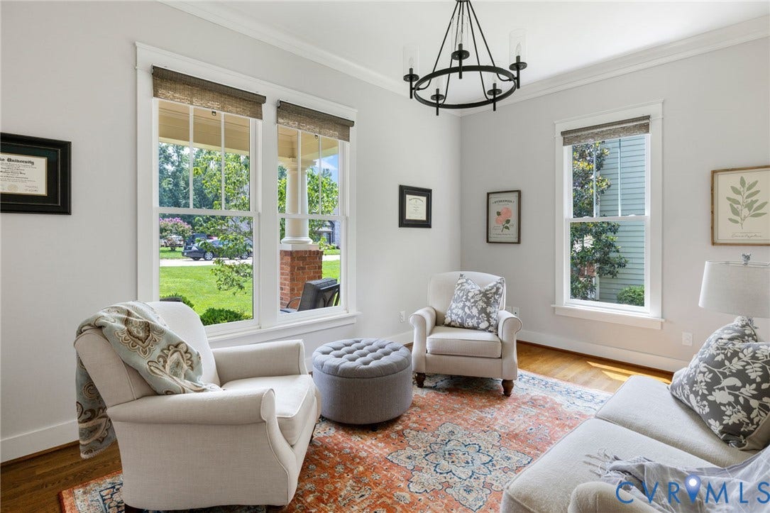 15918 Drumone Road, Hallsley, Midlothian, VA 23112 Room featuring wood-finish flooring, white crown molding, and multiple windows with woven Roman shades