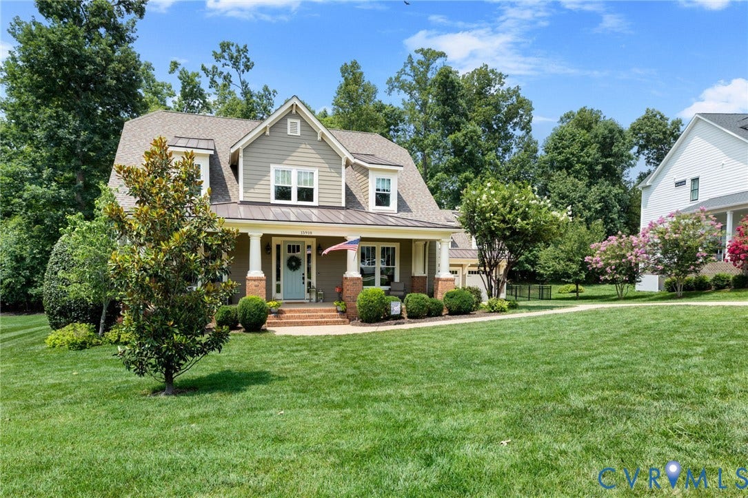 15918 Drumone Road, Hallsley, Midlothian, VA 23112 Traditional-style home featuring a covered front porch with white columns, light blue entry door, brick foundation, and siding exterior