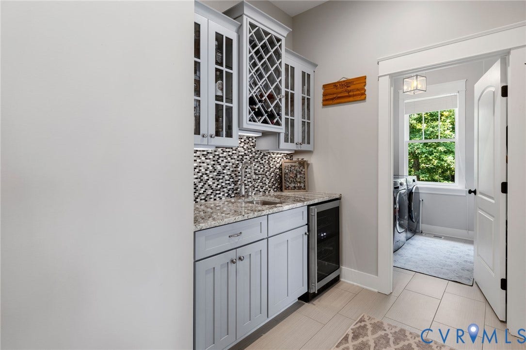 15918 Drumone Road, Hallsley, Midlothian, VA 23112 Entertainment bar featuring light gray cabinetry, built-in wine rack, mosaic tile backsplash, granite-finish countertop, and beverage cooler
