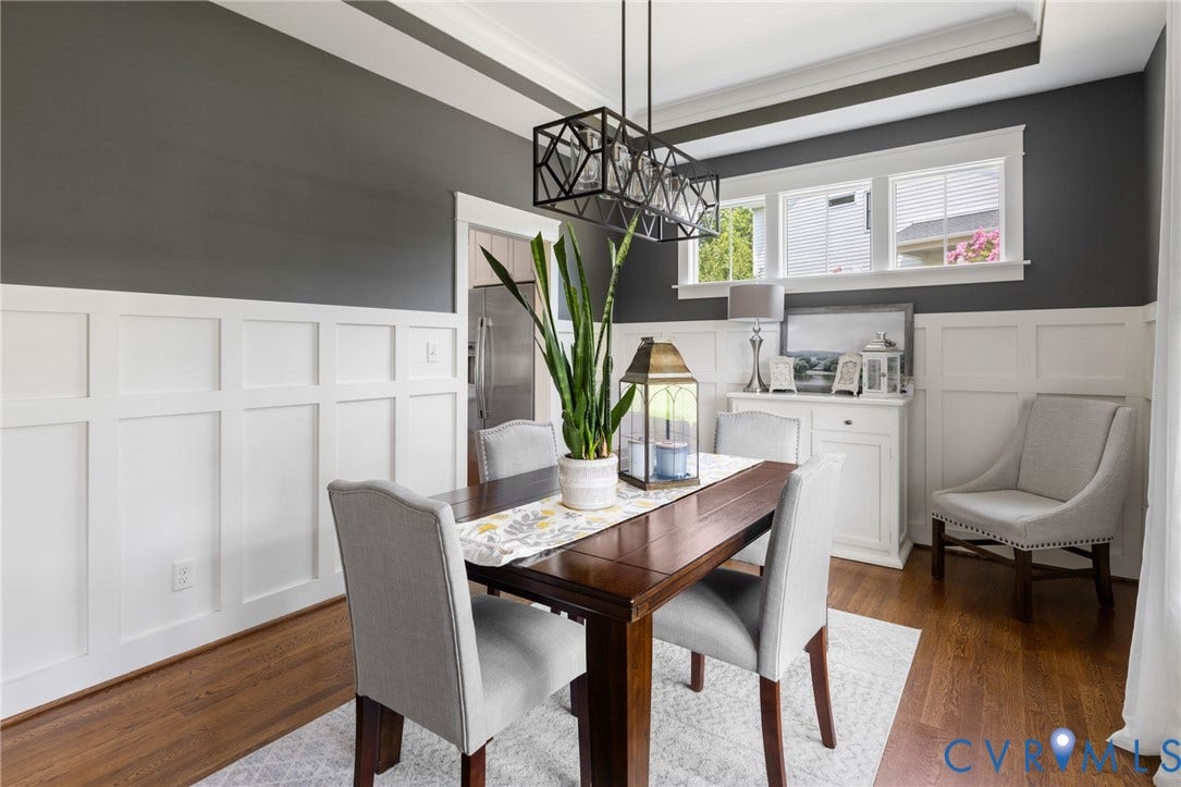 15918 Drumone Road, Hallsley, Midlothian, VA 23112 Dining area featuring a dark wood-finish table, board and batten wall treatment, and rich hardwood flooring