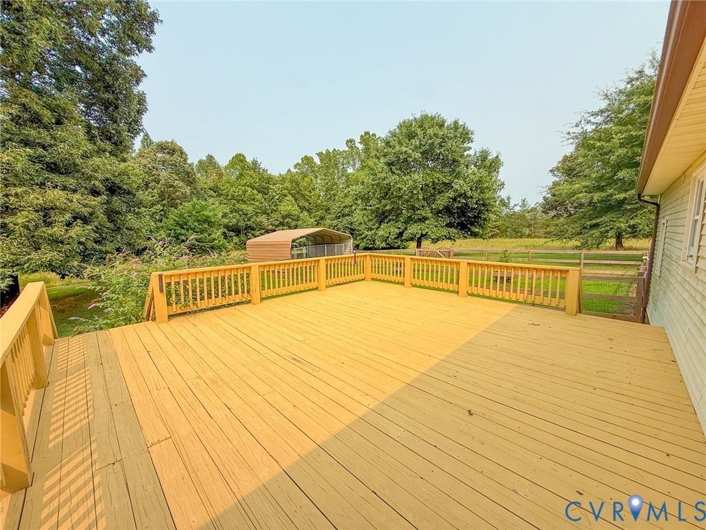 6688 Old Buckingham Road, Powhatan, VA 23139 Expansive outdoor deck featuring wood-finish flooring and a wood railing