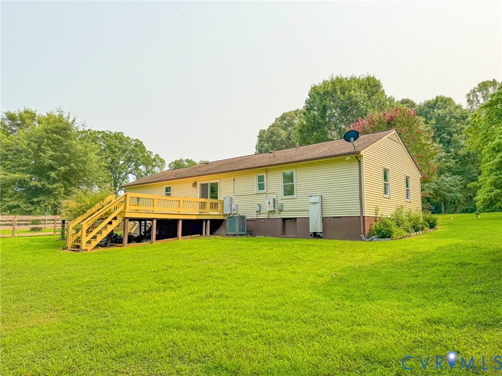 6688 Old Buckingham Road, Powhatan, VA 23139 Exterior siding with a spacious rear deck featuring wood railing and stairs
