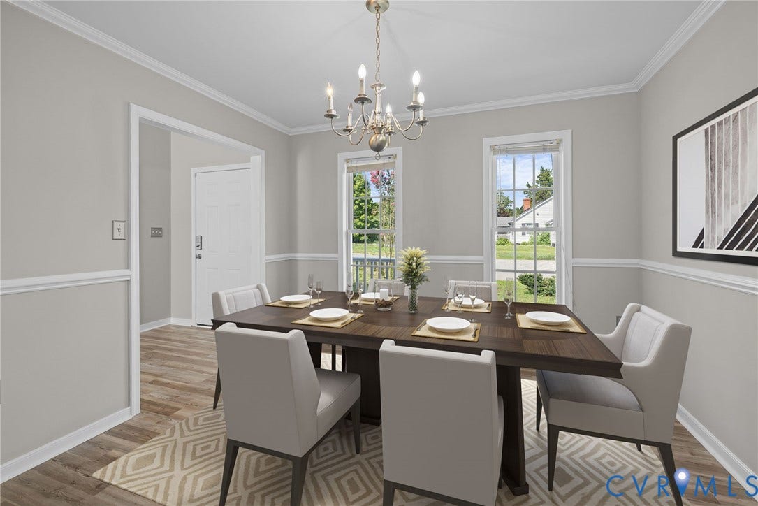5025 Alberta Mews, Chesterfield, VA 23832 Dining space featuring LVP flooring, two large windows, crown molding, chair rail molding, and a chandelier. Virtually staged concept