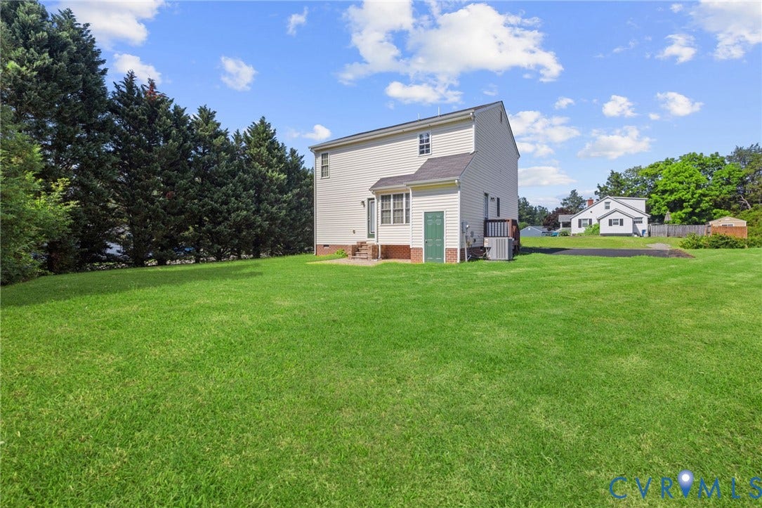 5025 Alberta Mews, Chesterfield, VA 23832 Expansive green lawn surrounds the property with mature evergreen trees bordering one side. Virtually edited grass