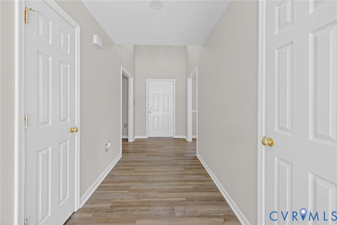 5025 Alberta Mews, Chesterfield, VA 23832 Central hallway featuring LVP flooring and light gray wall paint