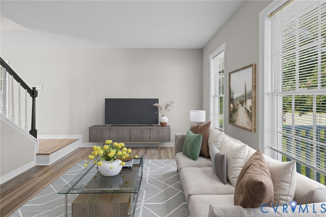 5025 Alberta Mews, Chesterfield, VA 23832 Light-filled living area featuring LVP flooring, a contemporary staircase with dark newel posts and white spindles, and multiple windows with blinds. Virtually staged concept