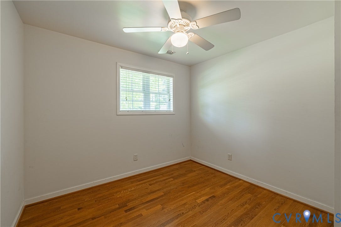 704 Forestview Drive, Colonial Heights, VA 23834 Bright interior space featuring wood-finish flooring, white baseboards, and a window with blinds