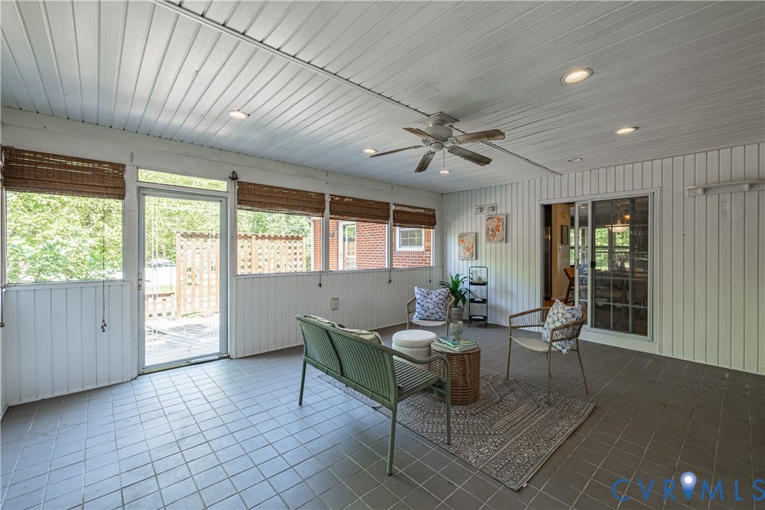 704 Forestview Drive, Colonial Heights, VA 23834 Screened porch featuring durable tile flooring, a paneled ceiling with recessed lighting and a ceiling fan, multiple windows with woven blinds, and a glass-paneled entry door
