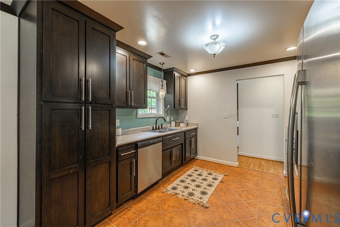 704 Forestview Drive, Colonial Heights, VA 23834 Kitchen featuring dark wood cabinetry, stainless steel dishwasher, light-toned countertops, ceramic tile flooring, and recessed lighting