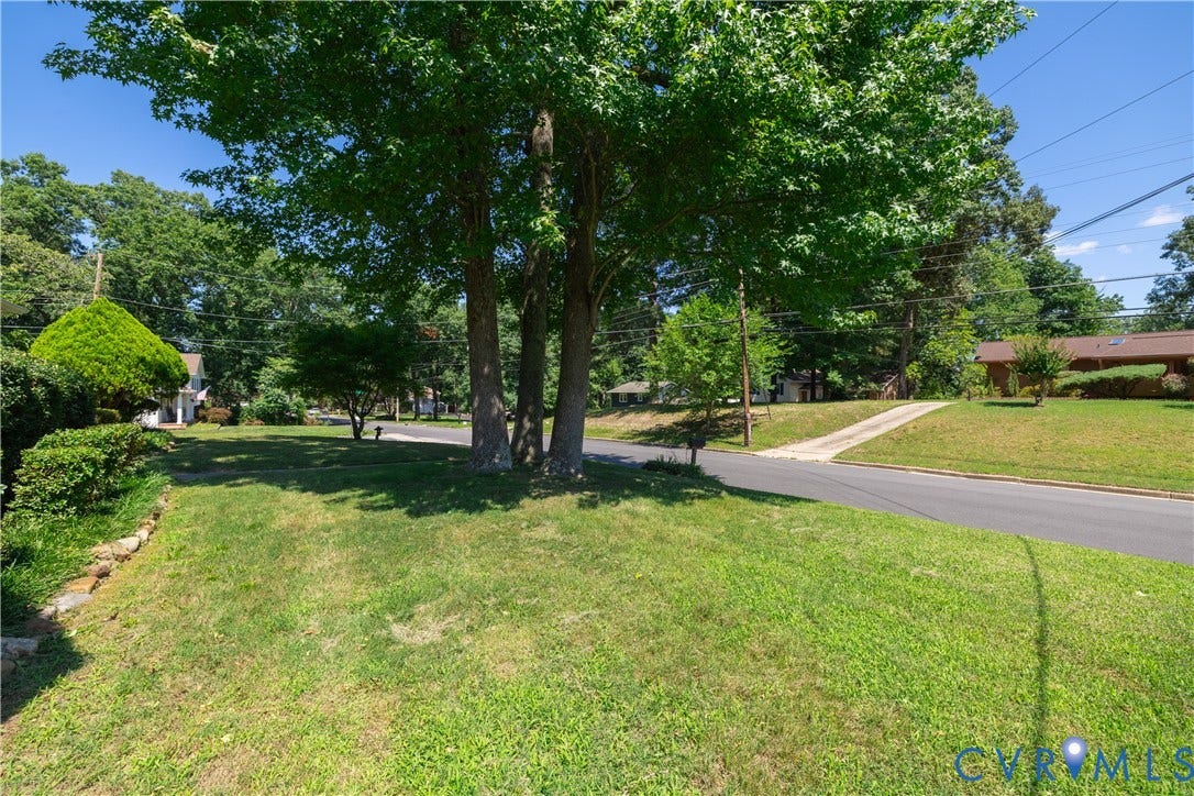 704 Forestview Drive, Colonial Heights, VA 23834 Expansive front yard featuring mature trees and a manicured lawn