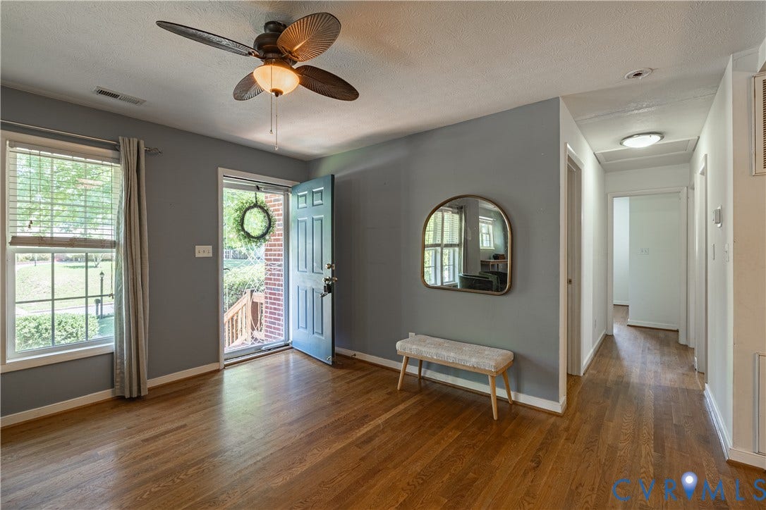 704 Forestview Drive, Colonial Heights, VA 23834 Inviting entry area featuring rich wood-finish flooring, a ceiling fan with integrated lighting, and a light blue entry door