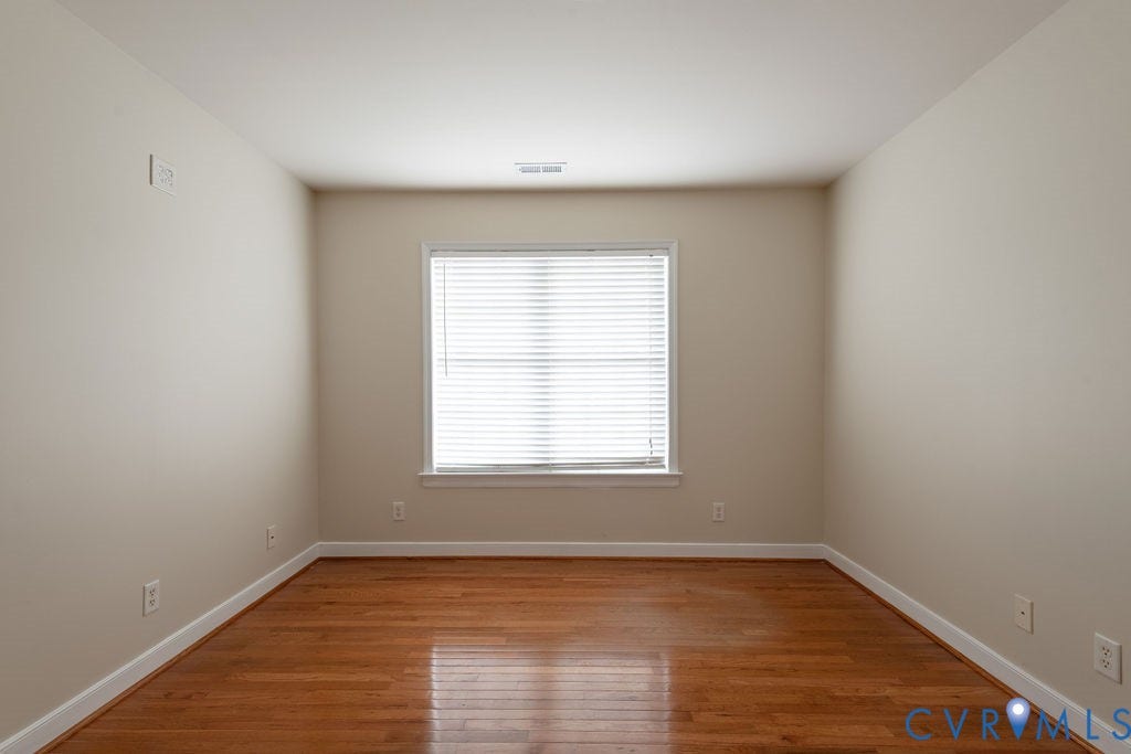 4924 Sadler Glen Ct, Sadler Glen, Glen Allen, VA 23060 Room featuring wood-finish flooring, neutral wall tones, and white trim