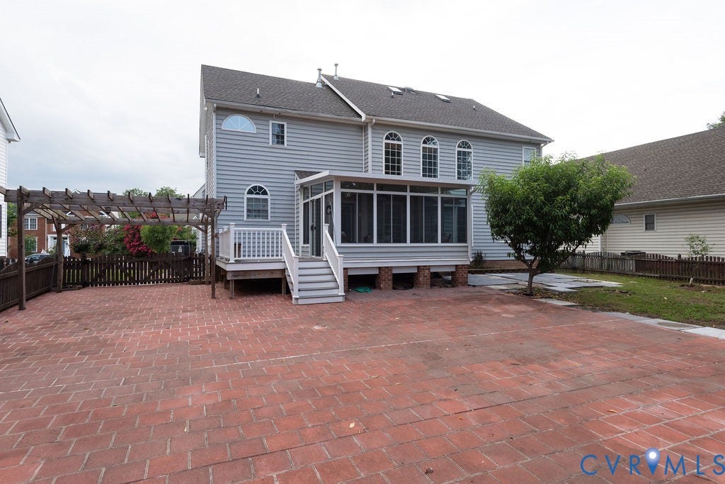4924 Sadler Glen Ct, Sadler Glen, Glen Allen, VA 23060 Spacious brick paver patio with an adjacent wood pergola, screened porch, and side deck with stairs