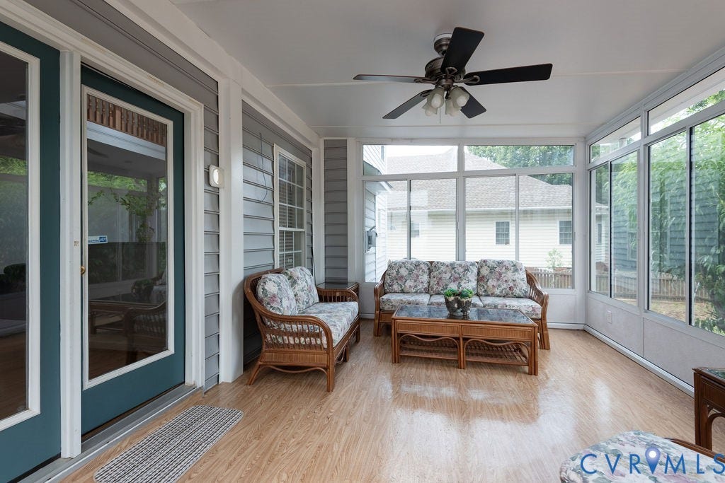 4924 Sadler Glen Ct, Sadler Glen, Glen Allen, VA 23060 Sunroom featuring expansive windows, wood-finish flooring, a ceiling fan with light fixture, and a glass-paneled exterior door