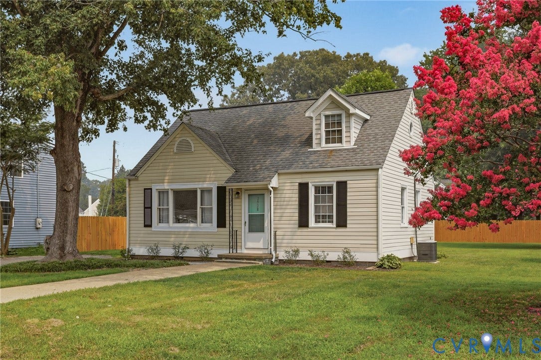 2928 W Strathmore Road, Bensley, North Chesterfield, VA 23237 Single-story home featuring light-colored siding, a dark shingle roof, and a prominent dormer