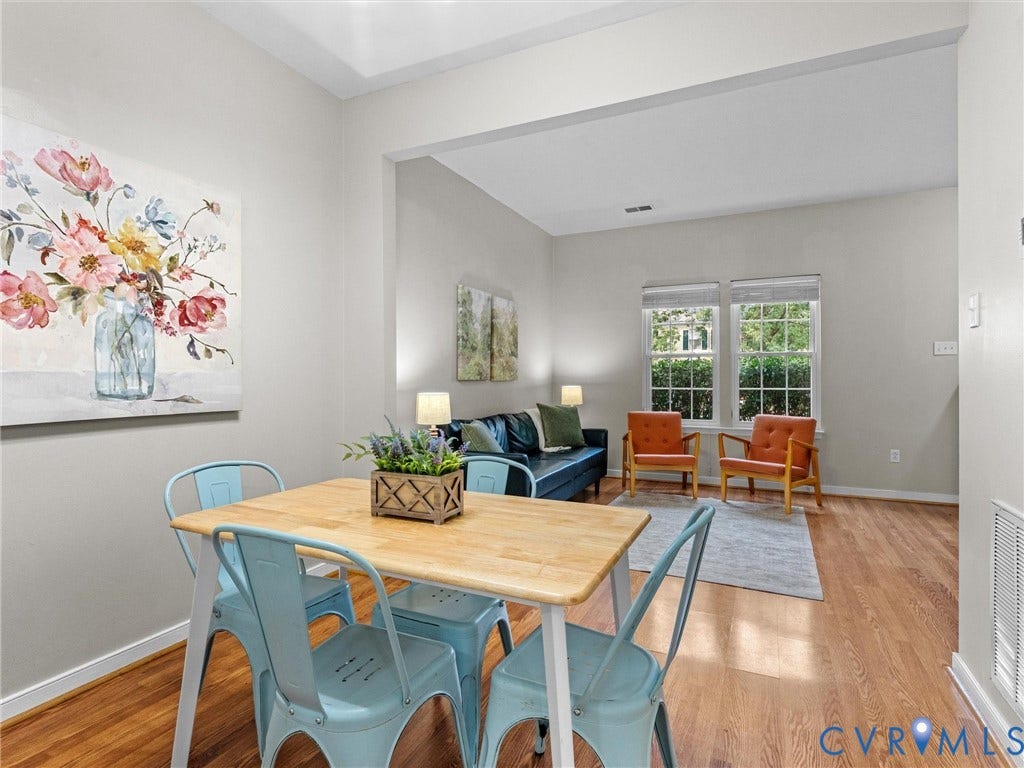 10100 Robin Lee Lane, Laurel Lakes, Glen Allen, VA 23060 Open-concept living space featuring wood-finish flooring, recessed lighting, and ample natural light from multiple windows