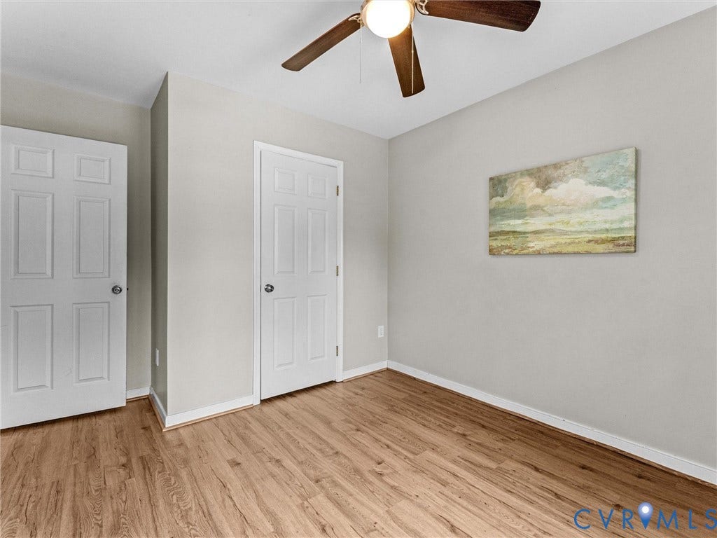 10100 Robin Lee Lane, Laurel Lakes, Glen Allen, VA 23060 Neutral-toned room featuring wood-finish flooring