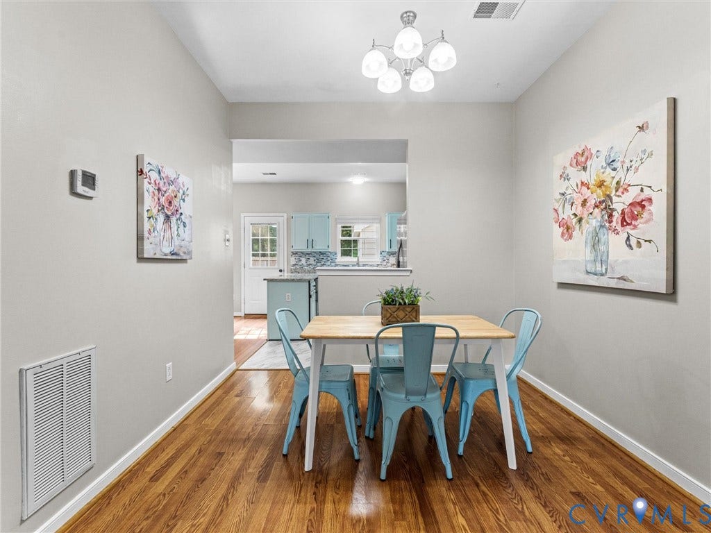 10100 Robin Lee Lane, Laurel Lakes, Glen Allen, VA 23060 Bright interior with wood-finish flooring and a contemporary five-light chandelier
