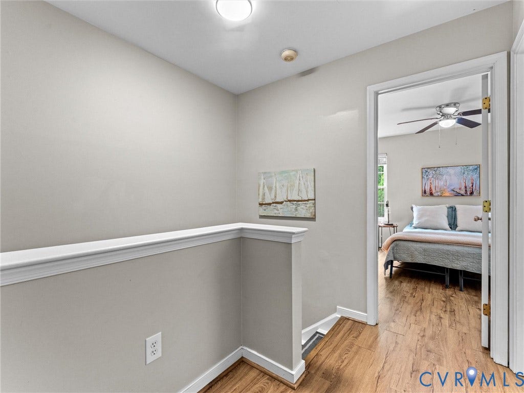10100 Robin Lee Lane, Laurel Lakes, Glen Allen, VA 23060 Hallway featuring wood-finish flooring, light-toned walls, and white trim