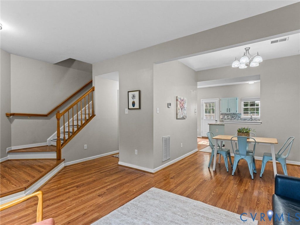 10100 Robin Lee Lane, Laurel Lakes, Glen Allen, VA 23060 Hardwood flooring throughout the main living areas, featuring a staircase with wood newel posts and handrail