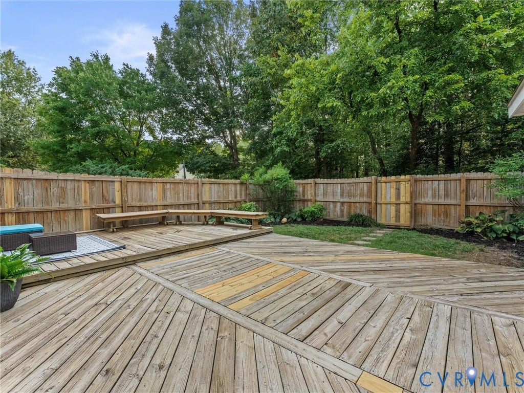 10100 Robin Lee Lane, Laurel Lakes, Glen Allen, VA 23060 Expansive backyard deck featuring a custom diagonal plank pattern and built-in bench seating