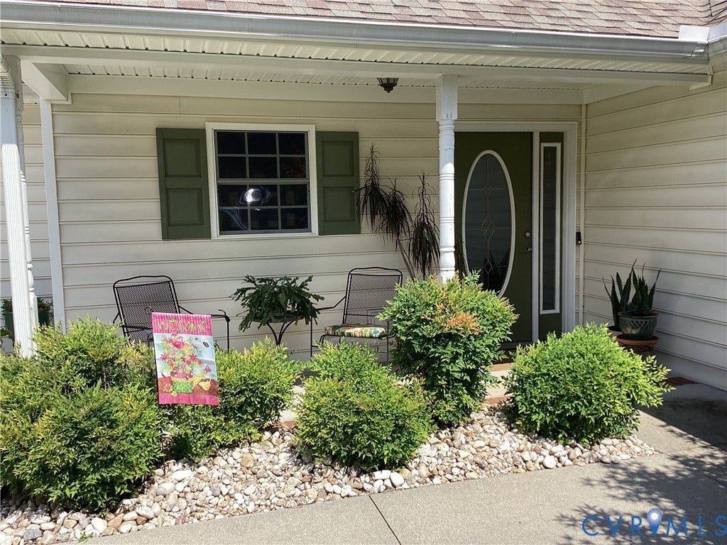 11611 Hillside Road, Chester, VA 23831 Inviting front porch featuring a seating area for morning tea with a neighbor.