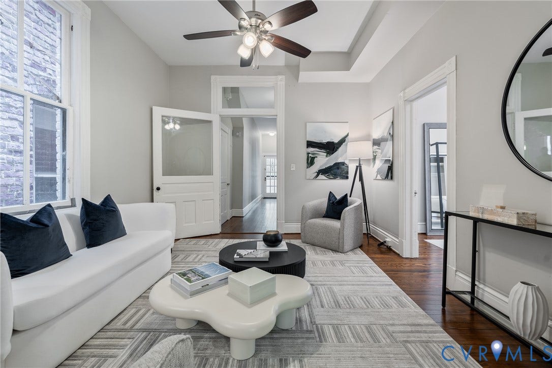2016 Princess Anne Avenue, Union Hill, Richmond, VA 23223 Living area featuring hardwood-finish flooring, a tray ceiling, and a ceiling fan