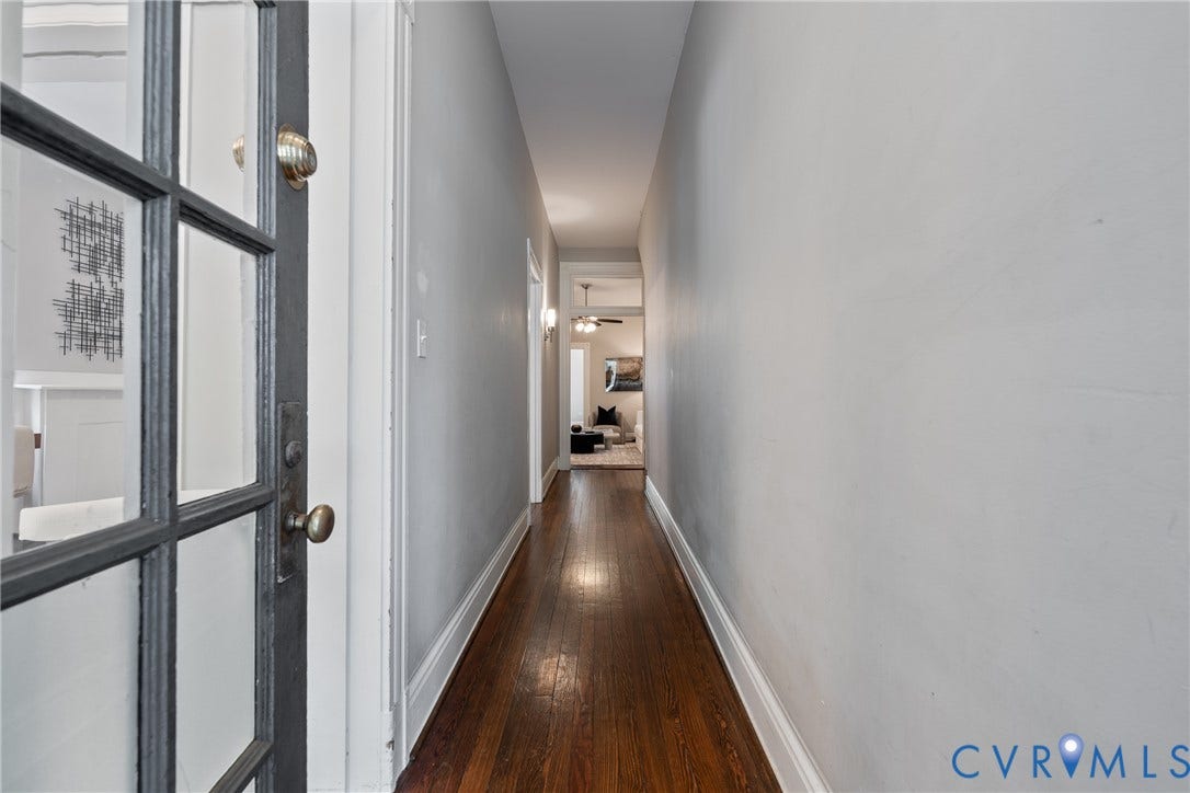 2016 Princess Anne Avenue, Union Hill, Richmond, VA 23223 Hallway with wood-finish flooring, light gray walls, and white trim