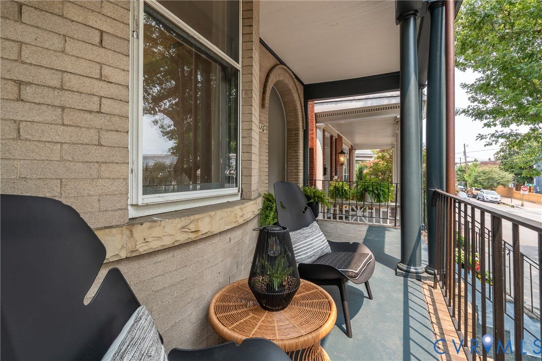 2016 Princess Anne Avenue, Union Hill, Richmond, VA 23223 Inviting porch featuring a painted floor, architectural columns, a black metal railing, and brick exterior