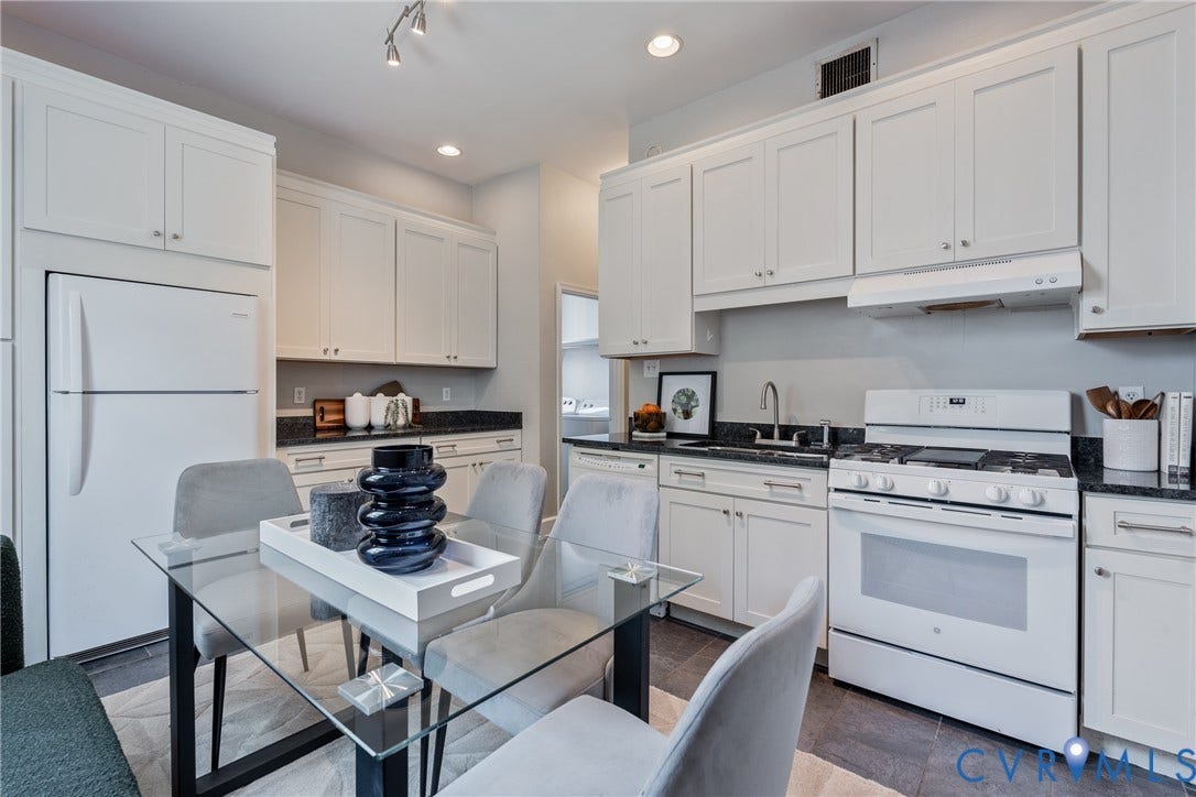 2016 Princess Anne Avenue, Union Hill, Richmond, VA 23223 Kitchen featuring white cabinetry, dark stone countertops, a white gas range, a white refrigerator, and track lighting