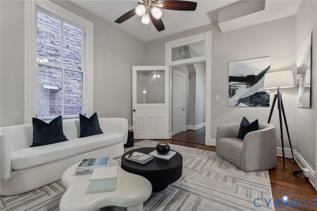 2016 Princess Anne Avenue, Union Hill, Richmond, VA 23223 Living area featuring high ceilings with a ceiling fan, hardwood flooring, and a large multi-pane window