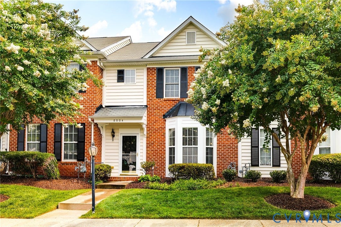 8004 Creekside Village Drive, Creekside Village, Mechanicsville, VA 23111 Brick and siding exterior featuring a covered entry, decorative bay window, and black louvered shutters