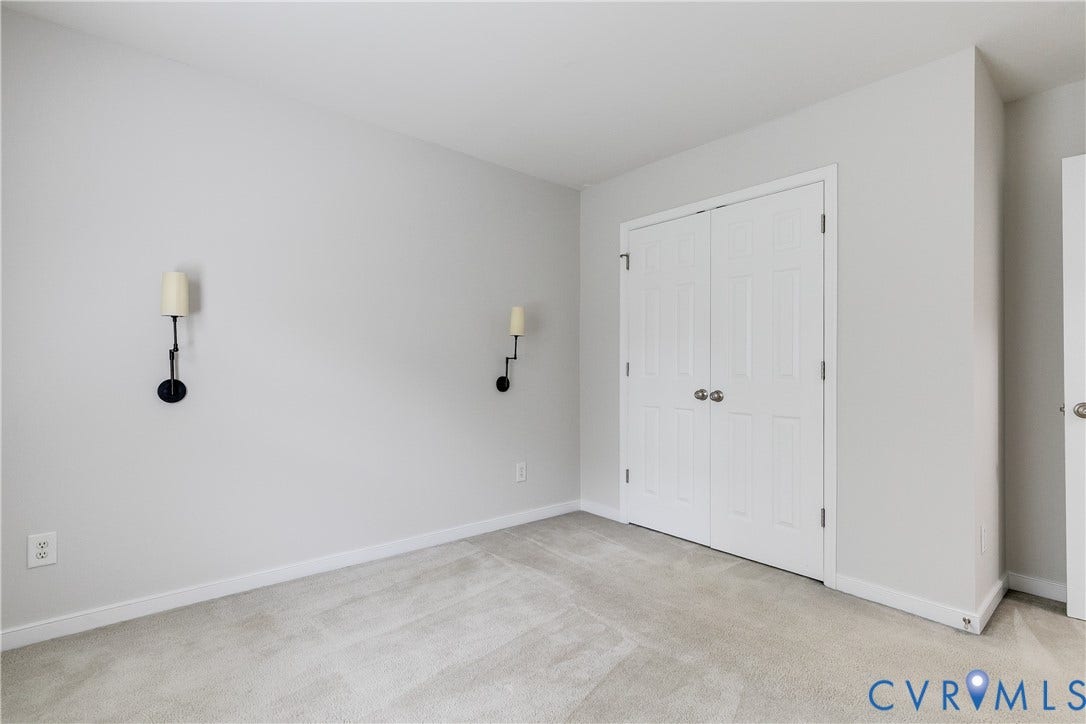 8004 Creekside Village Drive, Creekside Village, Mechanicsville, VA 23111 Neutral wall paint with white trim, light gray carpeting, and bifold closet doors