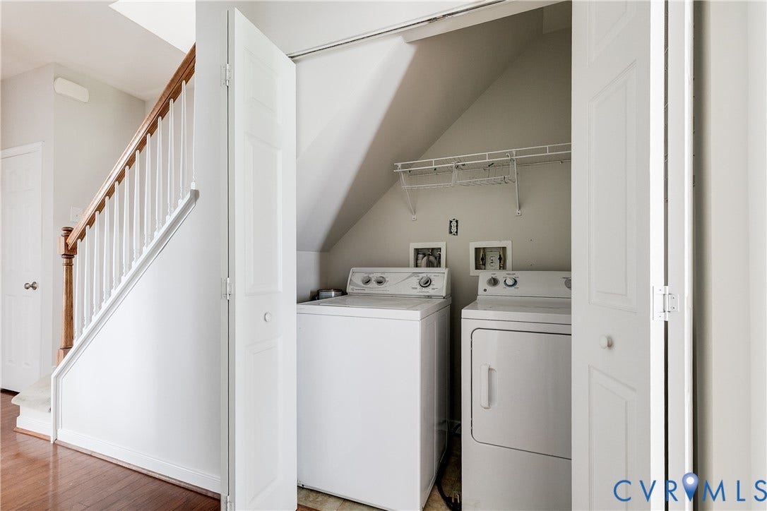 8004 Creekside Village Drive, Creekside Village, Mechanicsville, VA 23111 Dedicated laundry area featuring a washer and dryer, wire shelving, and bi-fold doors