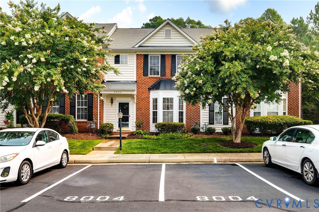 8004 Creekside Village Drive, Creekside Village, Mechanicsville, VA 23111 Townhome exterior featuring a brick and siding facade, bay window, and black louvered shutters