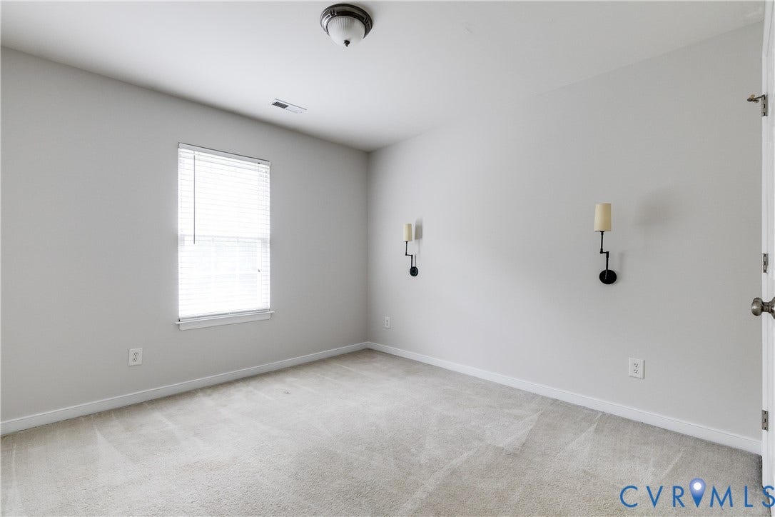 8004 Creekside Village Drive, Creekside Village, Mechanicsville, VA 23111 Carpeted room with a central window featuring horizontal blinds