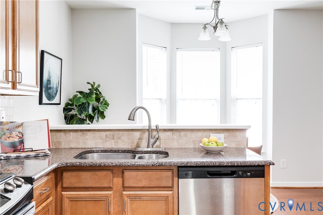 8004 Creekside Village Drive, Creekside Village, Mechanicsville, VA 23111 Kitchen featuring wood cabinetry, a double basin stainless steel sink with a gooseneck faucet, a stainless steel dishwasher, and a bay window