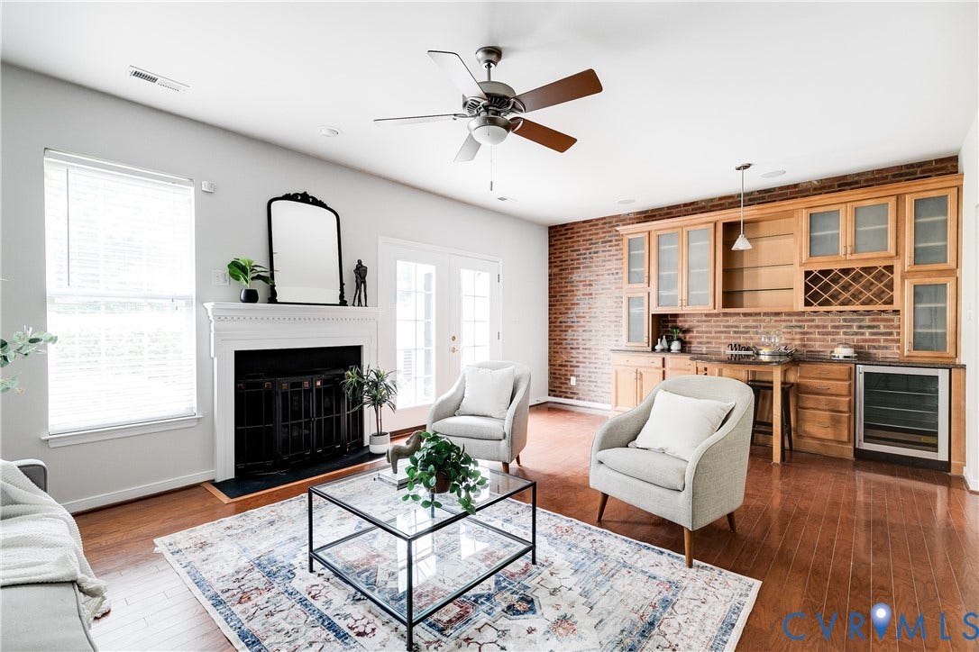8004 Creekside Village Drive, Creekside Village, Mechanicsville, VA 23111 Living space featuring wood-finish flooring, a white-mantled fireplace, and a ceiling fan