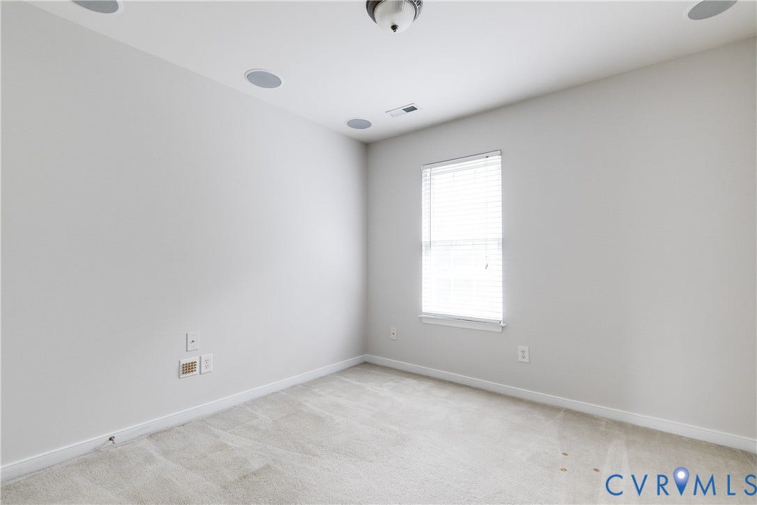 8004 Creekside Village Drive, Creekside Village, Mechanicsville, VA 23111 Neutral wall paint complementing light-toned carpeting, with a window featuring horizontal blinds