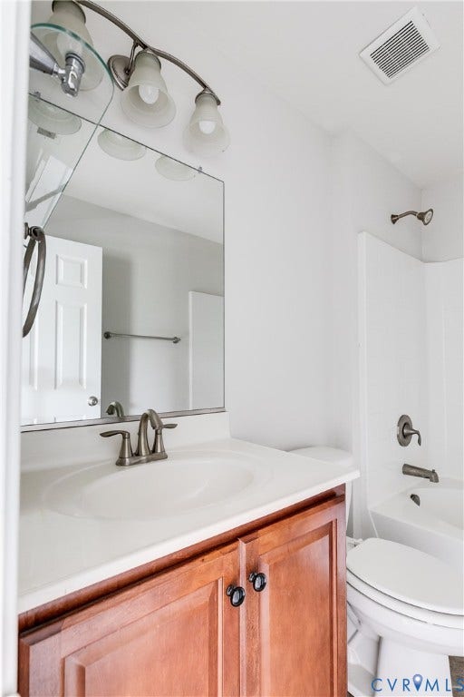 8004 Creekside Village Drive, Creekside Village, Mechanicsville, VA 23111 Bathroom vanity with a wood-finish base cabinet, white countertop, and integrated sink