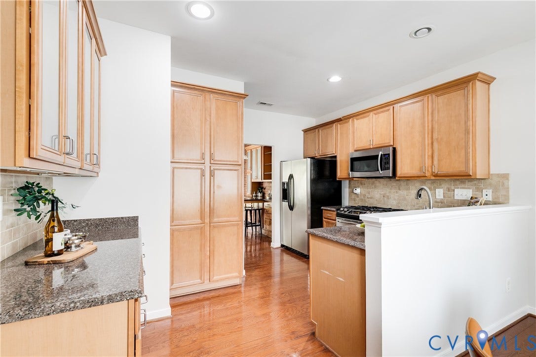 8004 Creekside Village Drive, Creekside Village, Mechanicsville, VA 23111 Kitchen featuring wood-finish flooring, recessed lighting, wood cabinetry, stone countertops, and stainless steel appliances