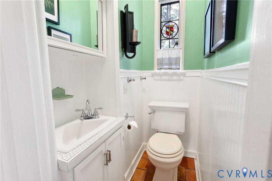 1/2 bath just off the kitchen.