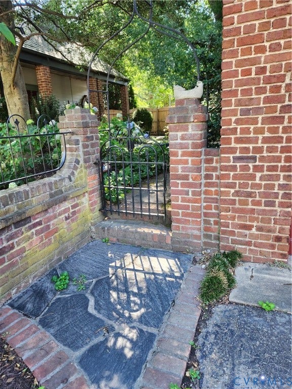 Brick and wrought iron side yard.