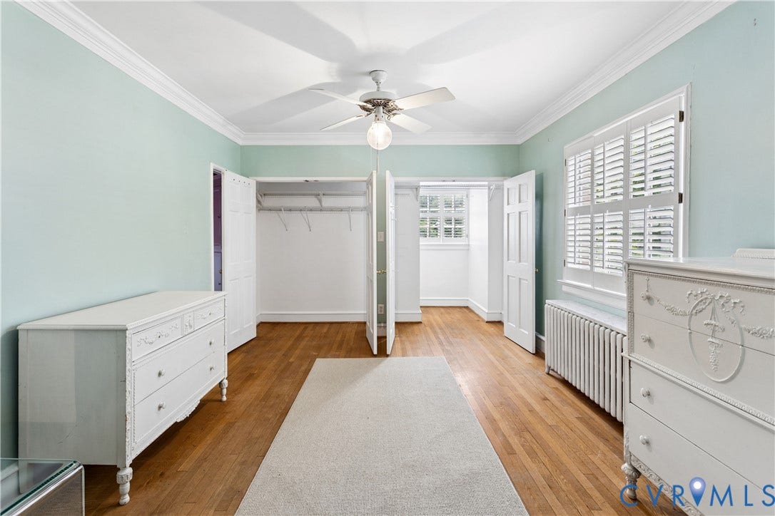 Primary has double closets, oak floors and shutters.